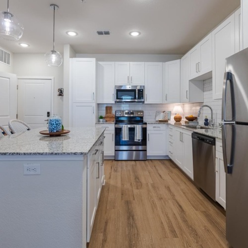 a kitchen with white cabinets