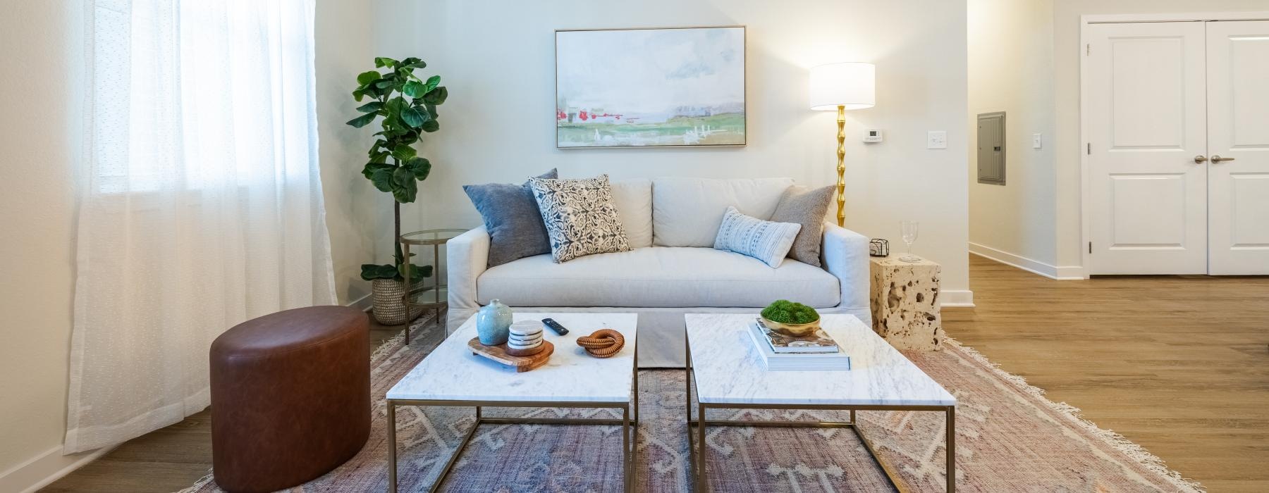 a living room with a couch and coffee table