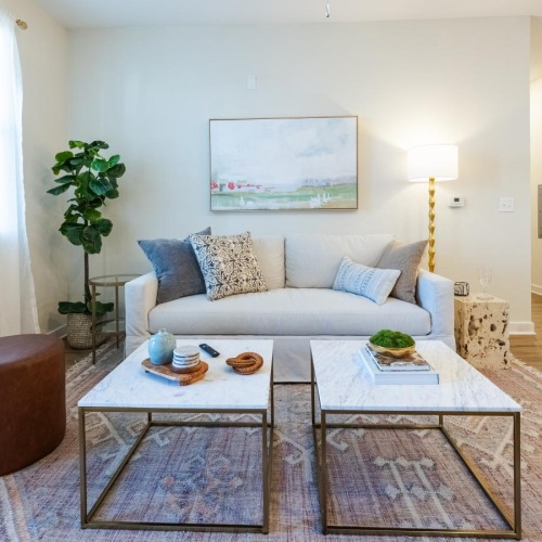 a living room with a couch and coffee table